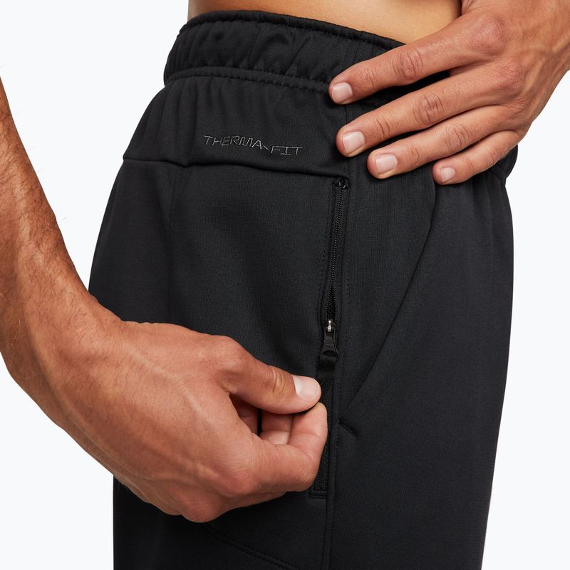 Spodnie treningowe męskie Nike Therma-FIT Open Hem black/black/white 4