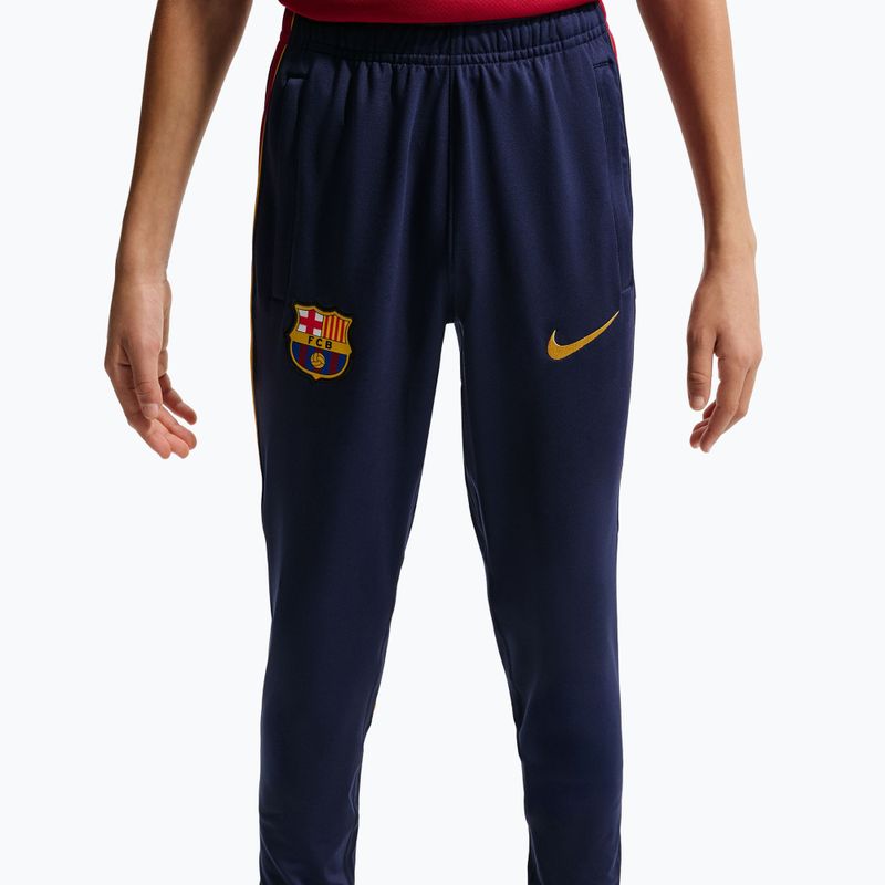Spodnie piłkarskie dziecięce Nike FC Barcelona Strike Dri-Fit blackened blue/noble red/yellow 7