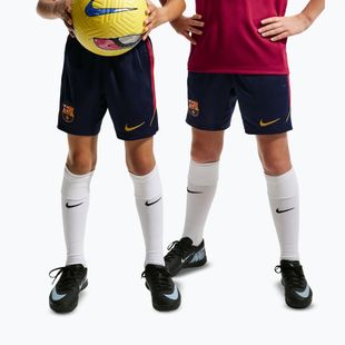 Spodenki piłkarskie dziecięce Nike FC Barcelona Strike blackened blue/noble red/mineral yellow